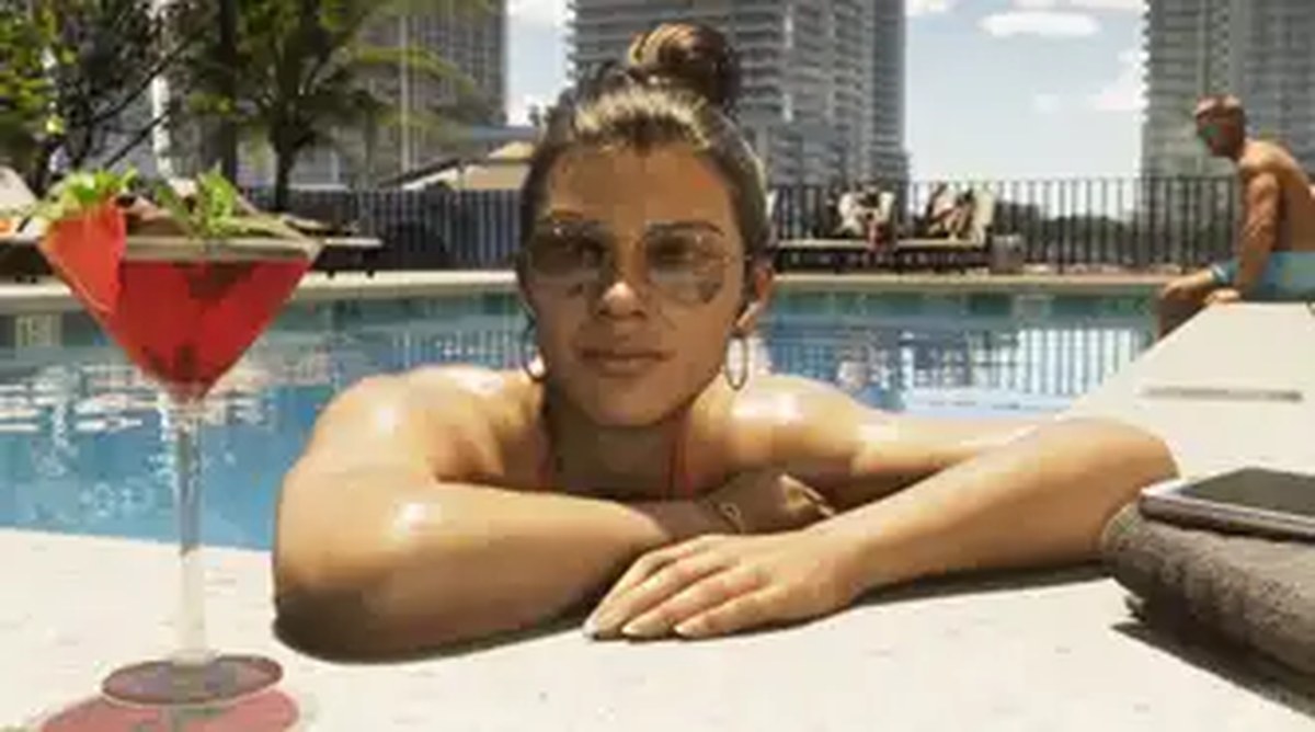 Lucia Caminos in GTA 6 resting by the side of a swimming pool with a cocktail.