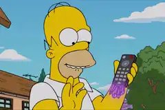 Homer Simpson holding up Zero Point remote controller in Fortnite