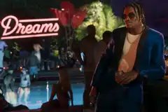 Dre'Quan Priest in Grand Theft Auto 6 leaning against the bar at a pool party.