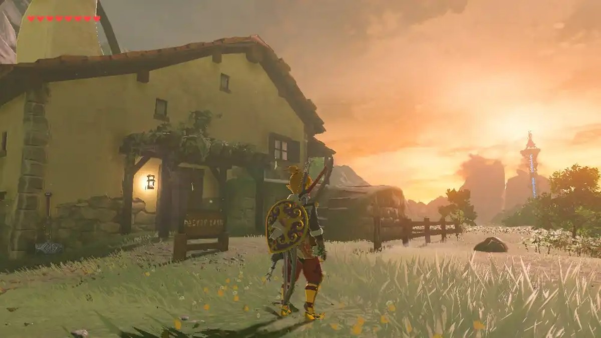 Link stands in front of a small village