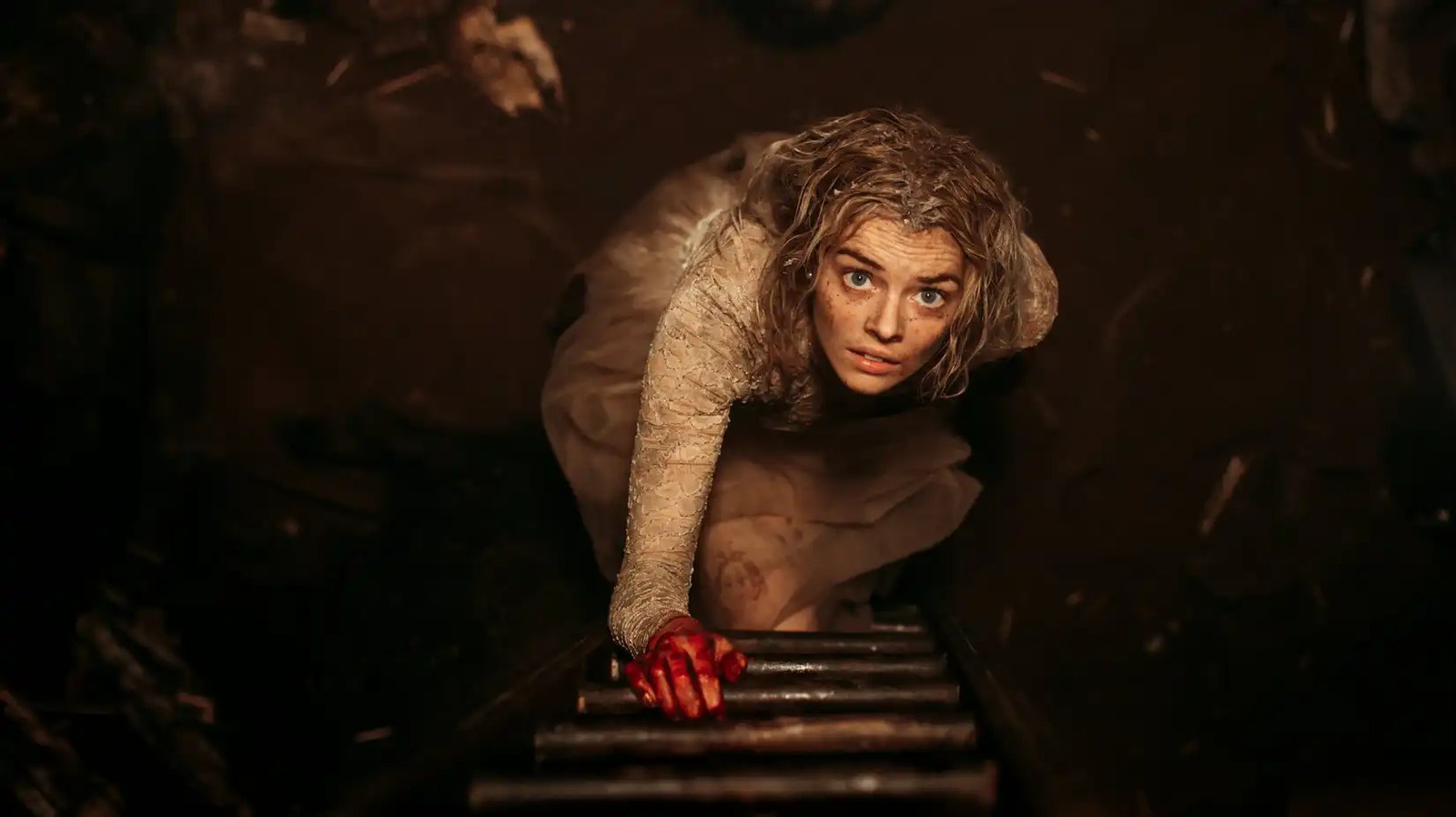 Grace climbs up a ladder in Ready or Not