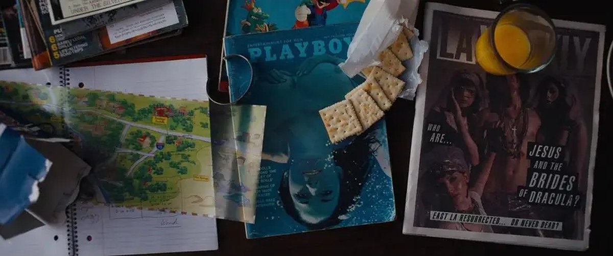 Sam goes through old magazines and maps to connect the dots in Under the Silver Lake