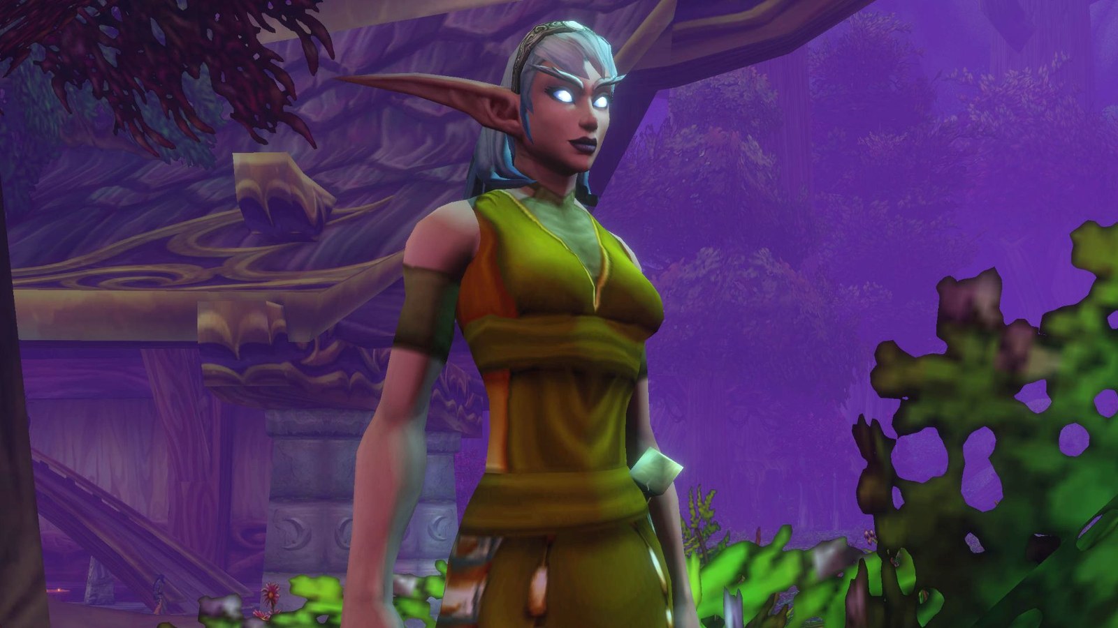 A screenshot of the World of Warcraft: Forever beta. A Night Elf stands in the moonlight with her glowing eyes.