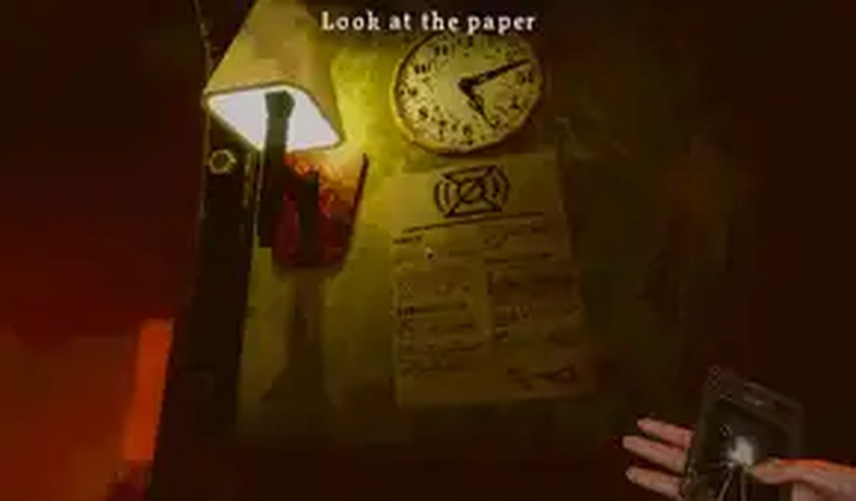 A piece of paper beneath a clock on a wall in Dreadline Express.