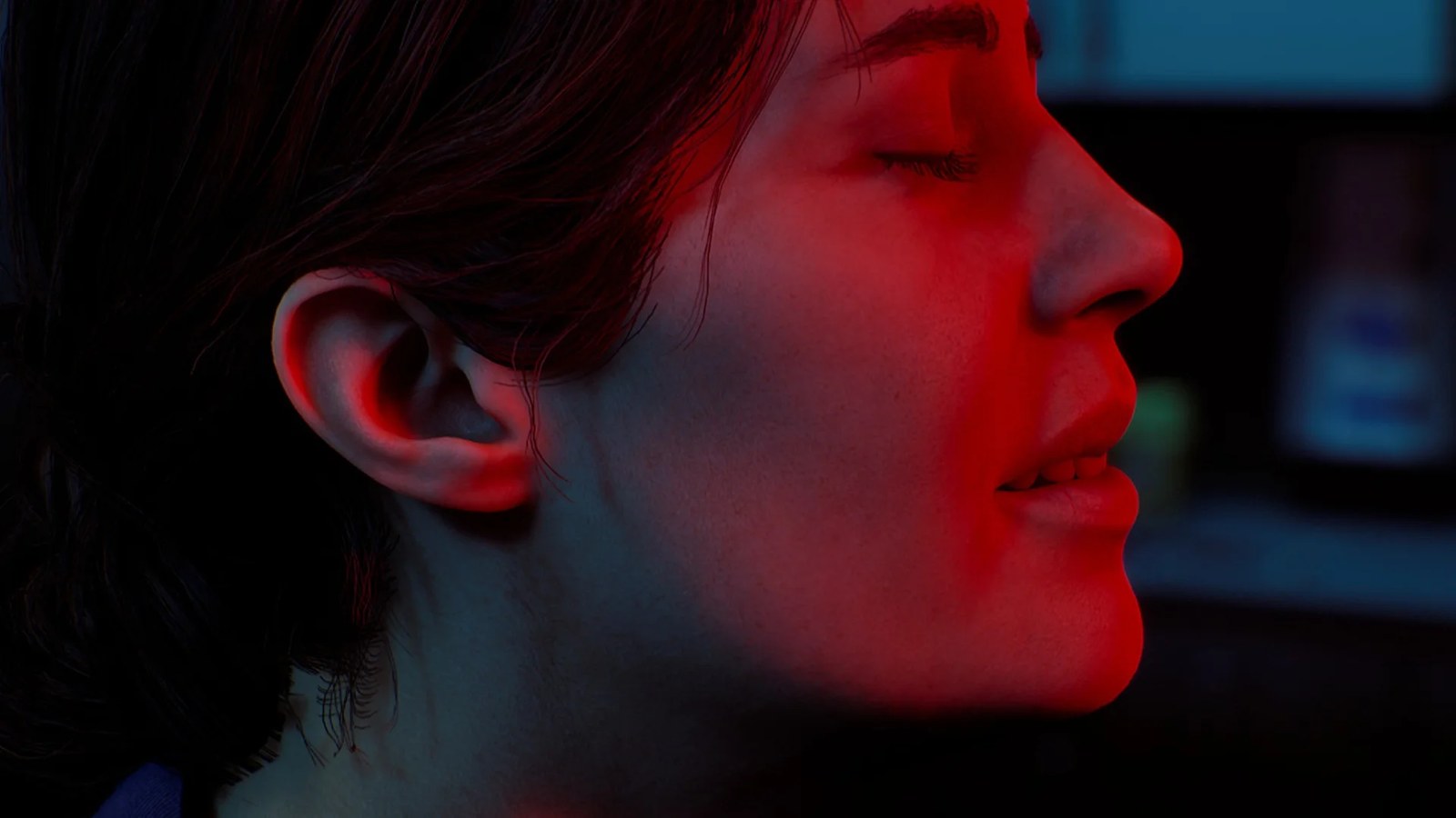 Silent Hill: Townfall screenshot showing a close-up of St. Amelia nurse Zoe Ellis bathed in blue and red light with a serene expression on her face.