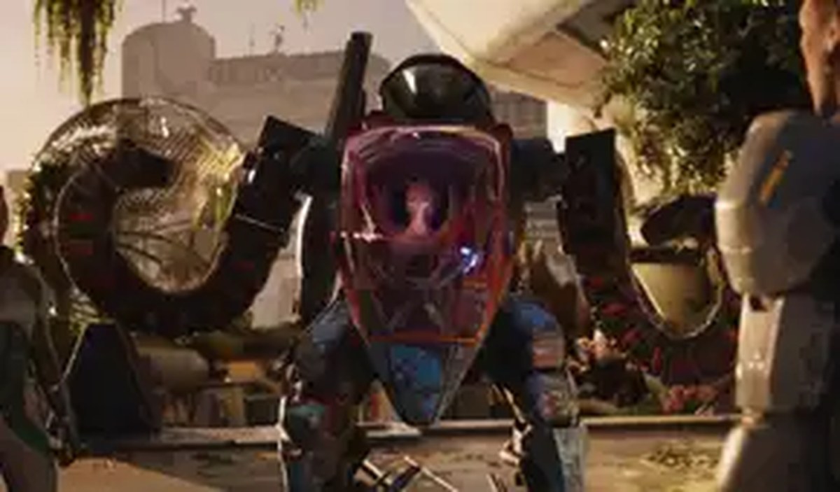 Salt wears a mech suit in a conversation in Exodus