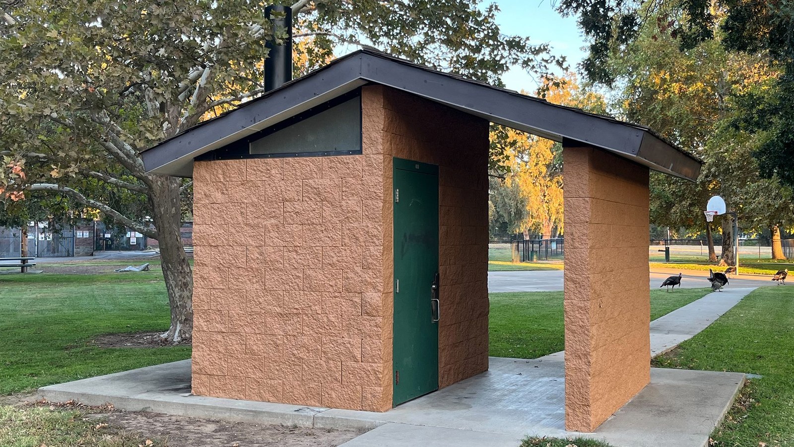 Small outdoor restroom in a park