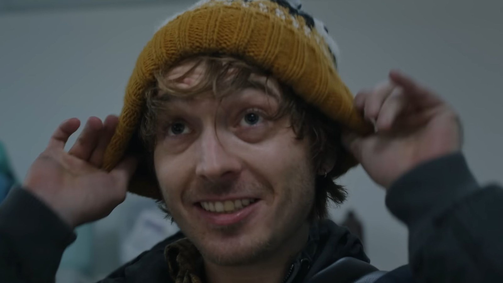 Bryan from Resident Evil putting on a hat