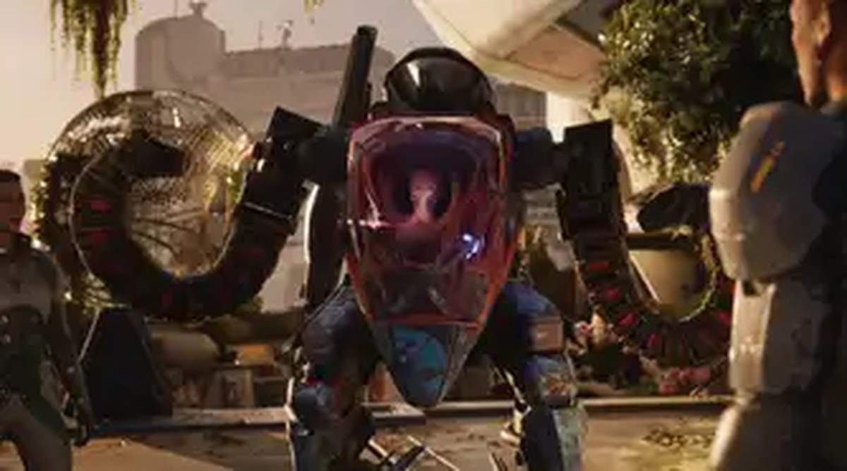 Salt wears a mech suit in a conversation in Exodus