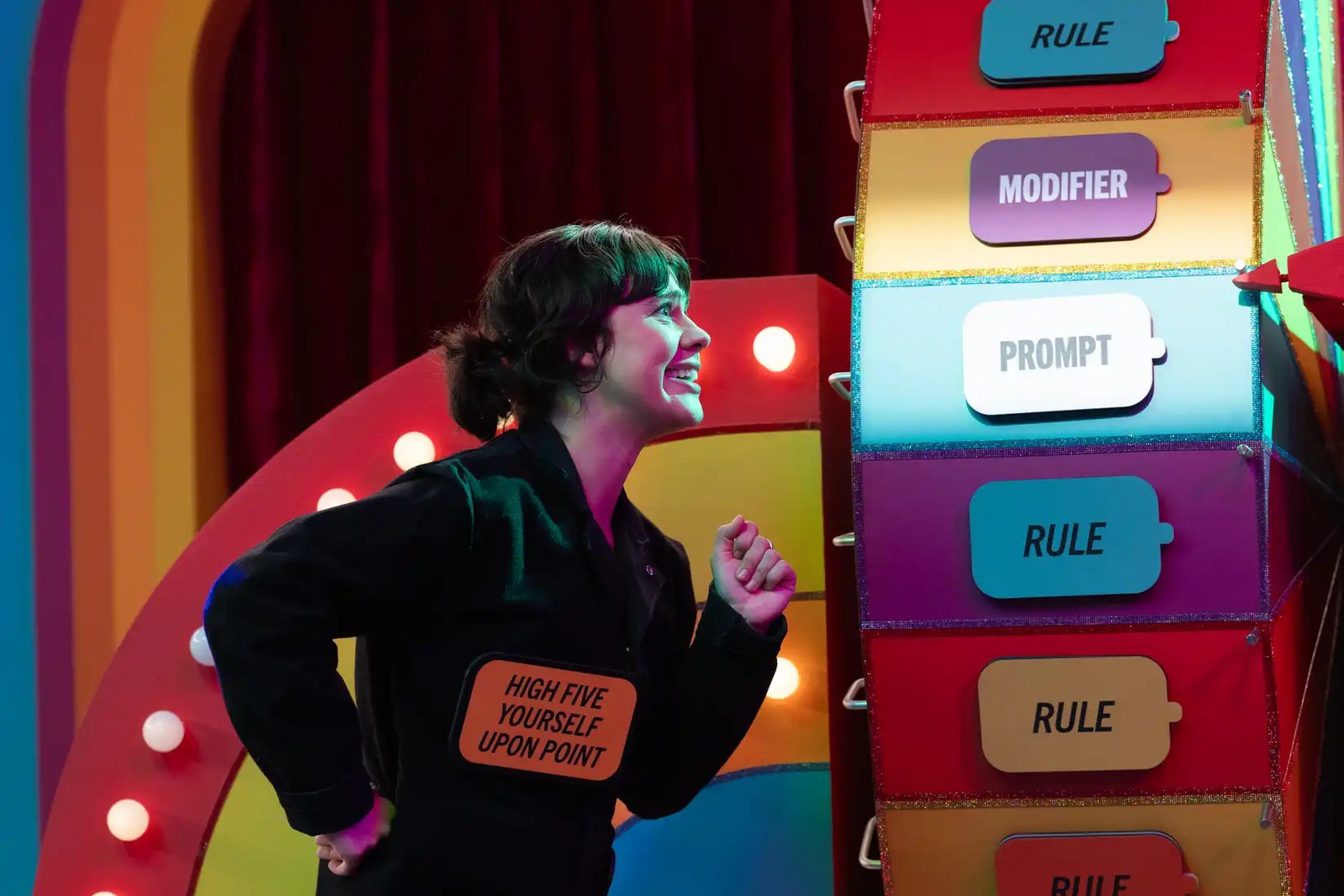 Game Changer's Anna Garcia standing in front of a giant wheel in the season 8 episode Rulette 2.