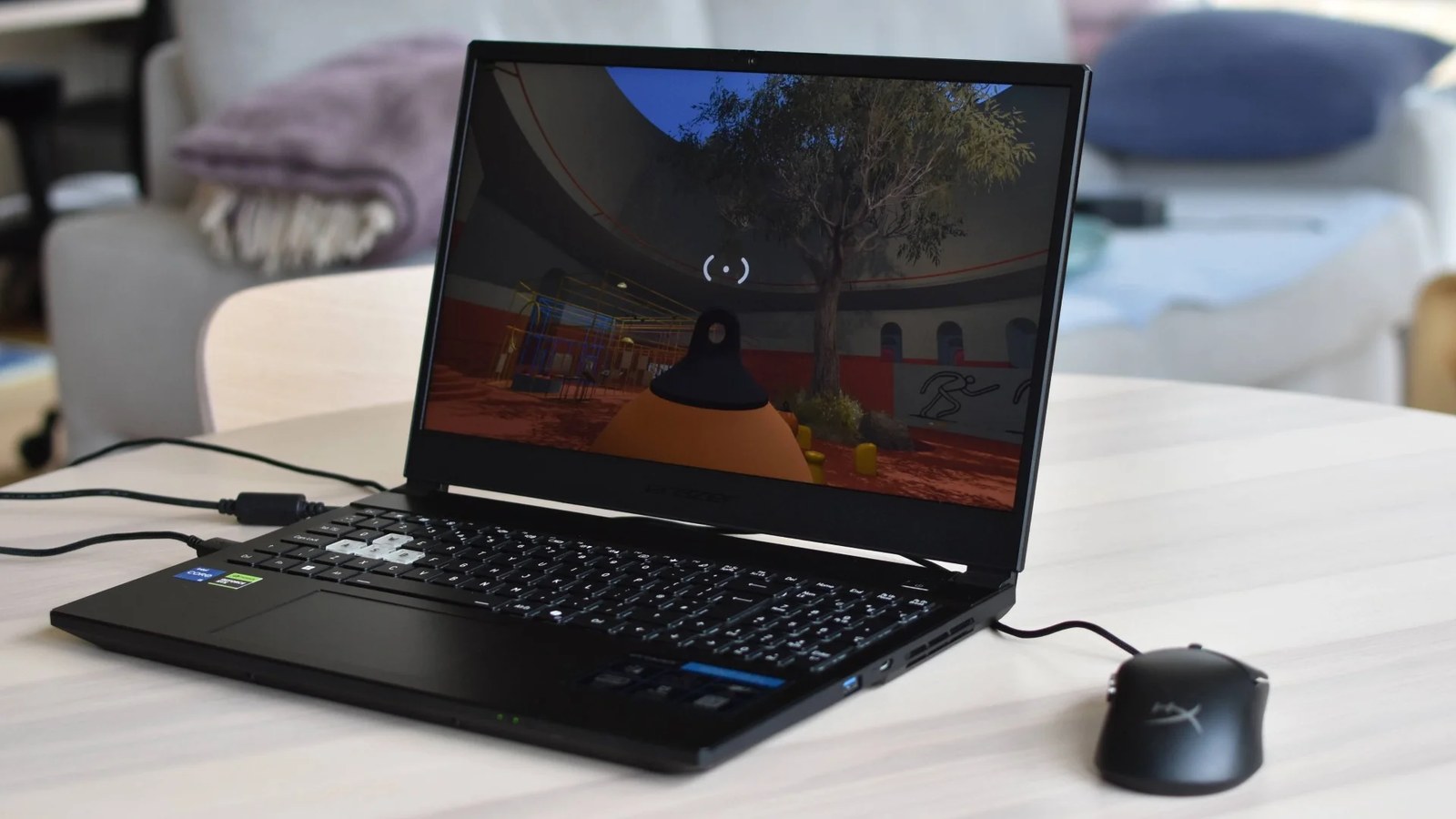 The Medion Erazer Scout 15 gaming laptop, running Big Walk, on a table.