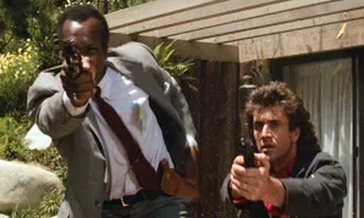 <b>10. Lethal Weapon</b> - Det. Roger Murtaugh (Danny Glover) is on the verge of retirement when he’s partnered with Det. Martin Riggs (Mel Gibson), a Vietnam War veteran and grieving widower who is on the verge of suicide. Together they crack down on a crime ring in Lethal Weapon, a movie that combines the breezy, conversational charms of a buddy cop flick with a grim and emotional crime drama. The sharp screenplay, written by Shane Black, gives Glover and Gibson juicy material and hilarious jokes, and puts them in one tough-as-nails, life-or-death situation after another.