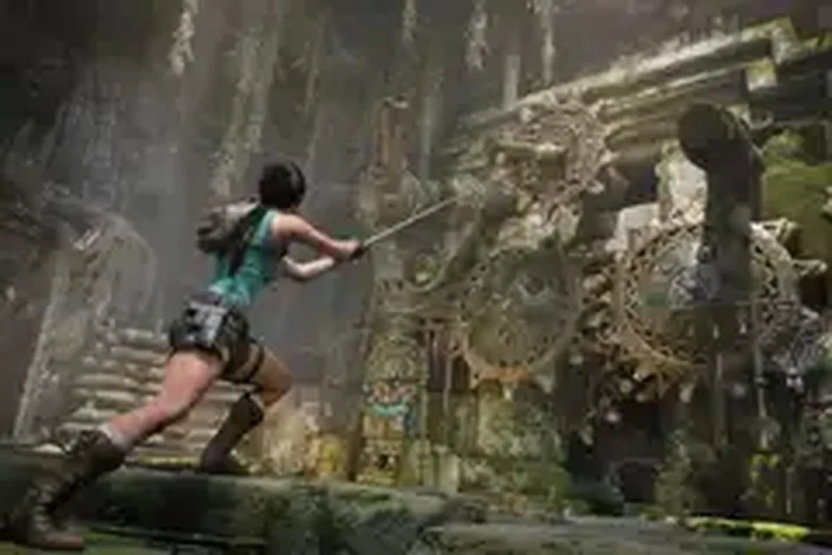 Lara Croft yanks a gear with a hook in Tomb Raider: Legacy of Atlantis.