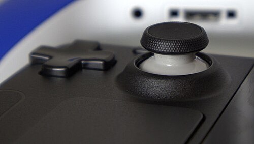 Close view of the Steam Deck directional pad, thumbstick, and portion of trackpad